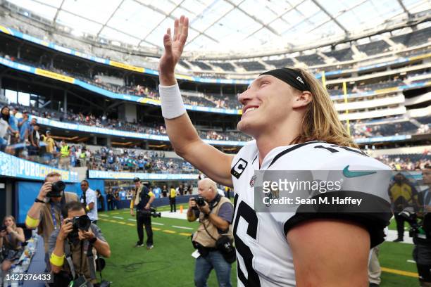 Trevor Lawrence of the Jacksonville Jaguars waves to the crowd after his team's 38-10 win against the Los Angeles Chargers at SoFi Stadium on...