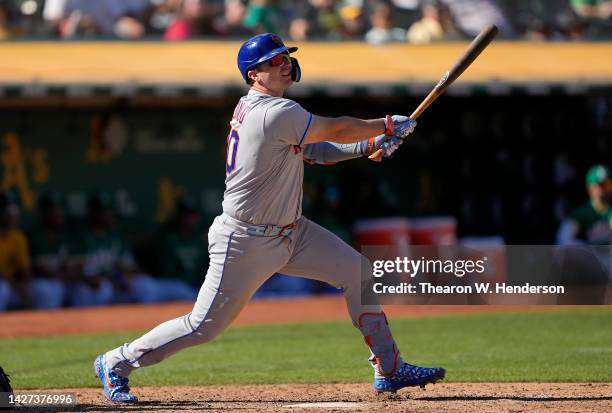 Pete Alonso of the New York Mets hits an rbi double against the Oakland Athletics in the top of the eighth inning at RingCentral Coliseum on...