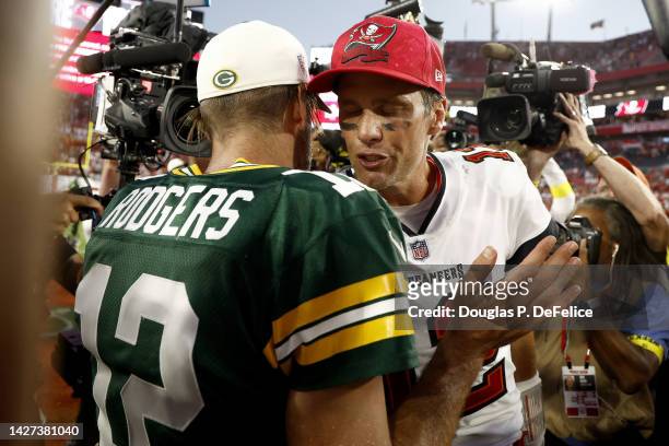 Aaron Rodgers of the Green Bay Packers talks with Tom Brady of the Tampa Bay Buccaneers after the game at Raymond James Stadium on September 25, 2022...