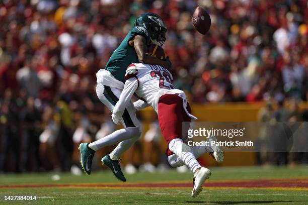 Wide receiver DeVonta Smith of the Philadelphia Eagles catches a touchdown over cornerback Kendall Fuller of the Washington Commanders during the...