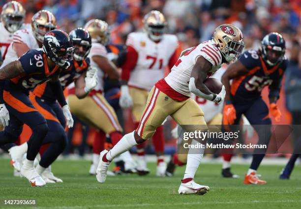 Jeff Wilson Jr. #22 of the San Francisco 49ers rushes during the first half against the Denver Broncos at Empower Field At Mile High on September 25,...