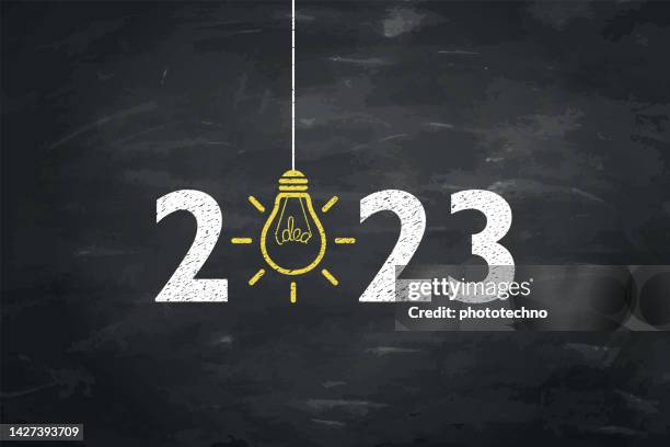 new year 2023 new idea concepts on chalkboard background - new years resolution stock illustrations