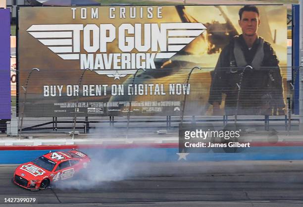 Kevin Harvick, driver of the Hunt Brothers Pizza Ford, spins after an on-track incident during the NASCAR Cup Series Auto Trader EchoPark Automotive...