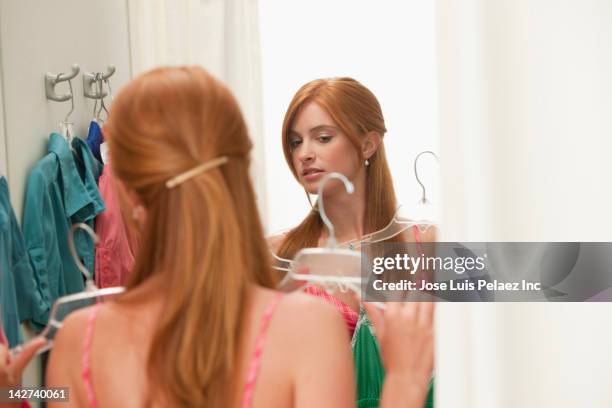 caucasian teenage girl in dressing room - girl changing room shop stock pictures, royalty-free photos & images