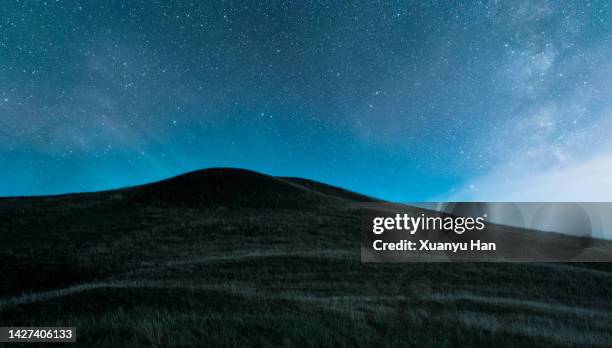 starry night in mountains - hill stock pictures, royalty-free photos & images