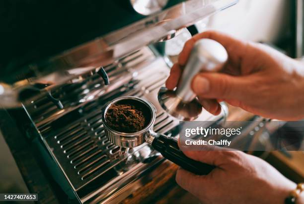 preparing an espresso at home - ground coffee stock pictures, royalty-free photos & images