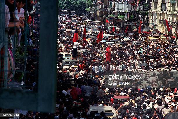 Burmese woman stands on a stage 27 August 1988, leading hundreds of thousand of anti-government protestors, most of them students who gathered at...