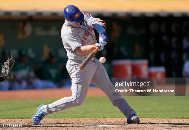 Pete Alonso of the New York Mets hits a bases loaded three-run rbi double against the Oakland Athletics in the top of the eighth inning at...