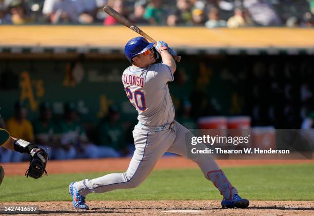 Pete Alonso of the New York Mets hits a bases loaded three-run rbi double against the Oakland Athletics in the top of the eighth inning at...