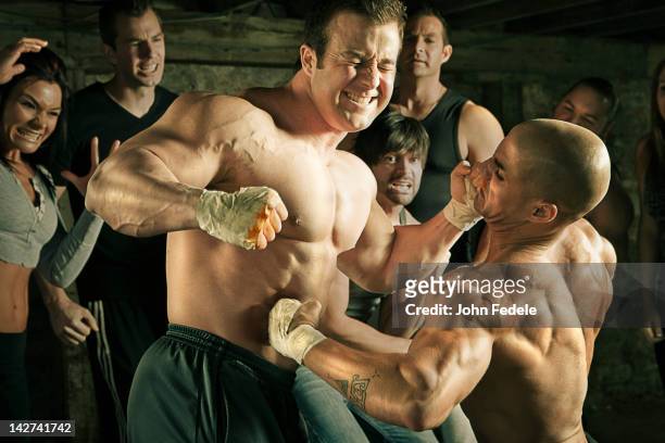 people watching two men boxing without gloves - belly punching stock pictures, royalty-free photos & images