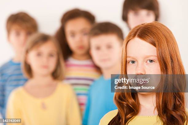 girl separate from other children - 10 to 13 years stock pictures, royalty-free photos & images