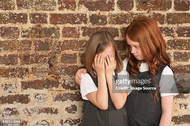 girl comforting her friend - best friends kids stock pictures, royalty-free photos & images