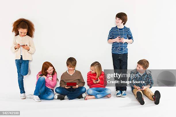 children using different gadgets - 10 to 13 years stock pictures, royalty-free photos & images
