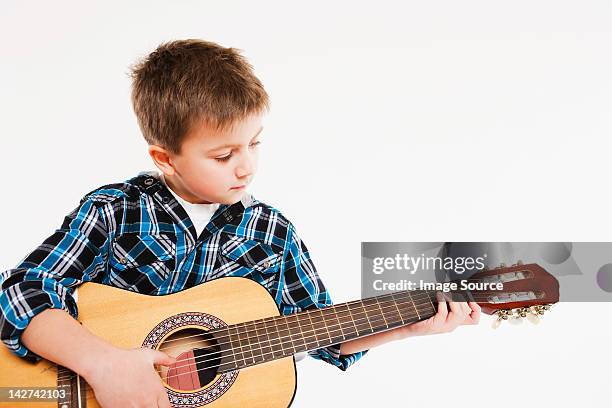 boy playing guitar - acoustic guitar white background stock pictures, royalty-free photos & images