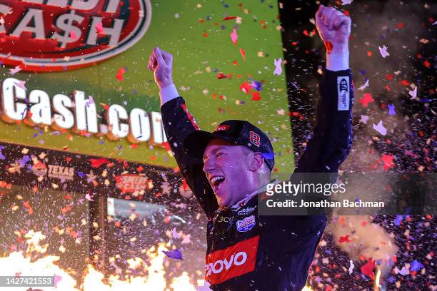 Tyler Reddick, driver of the Lenovo/ThinkEdge Chevrolet, celebrates in victory lane after winning the NASCAR Cup Series Auto Trader EchoPark...