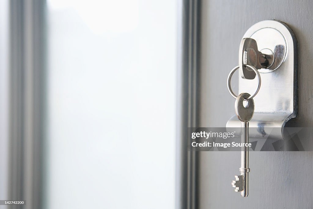 Close up of key in a front door