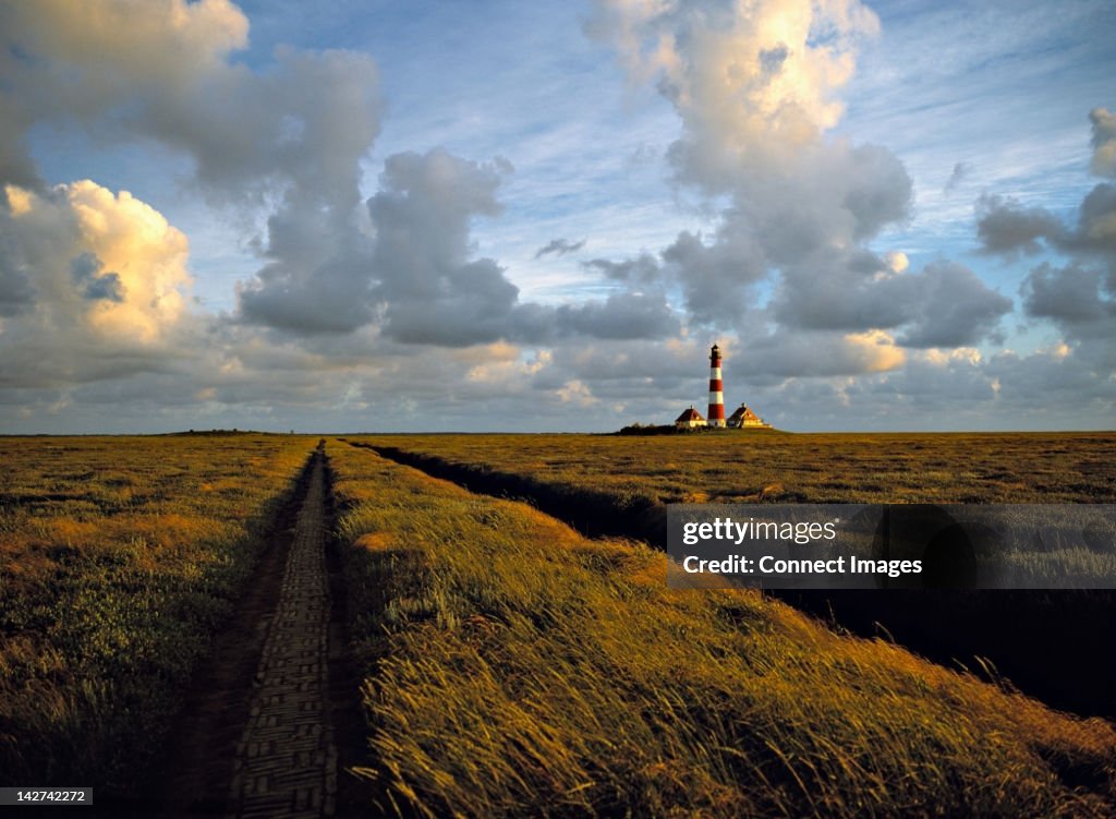 Westerhever lighthouse in marshland, Schleswig-Holstein, Germany