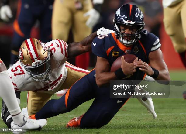 Russell Wilson of the Denver Broncos rushes during the first half against the San Francisco 49ers at Empower Field At Mile High on September 25, 2022...