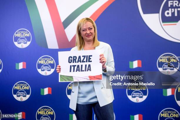 Giorgia Meloni, leader of the Fratelli d'Italia holds a "Thank You Italy" sign during a press conference at the party electoral headquarters...