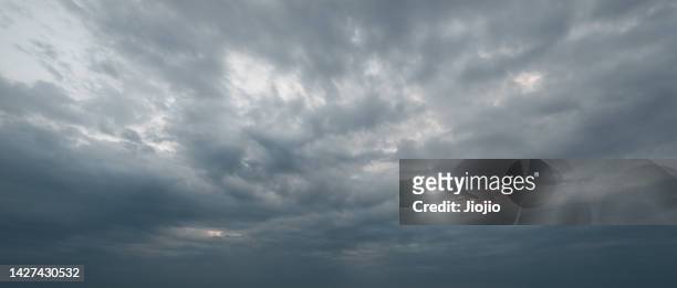 black clouds - dramatic sky stock-fotos und bilder
