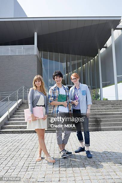 university students standing at campus - international student day stock pictures, royalty-free photos & images