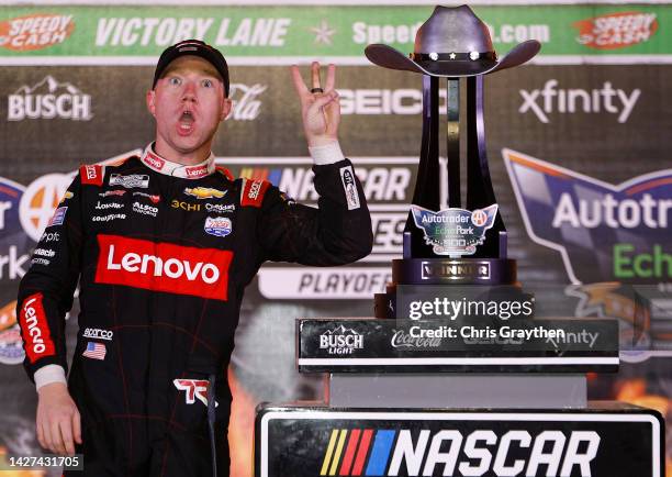 Tyler Reddick, driver of the Lenovo/ThinkEdge Chevrolet, and crew celebrate in victory lane after winning the NASCAR Cup Series Auto Trader EchoPark...