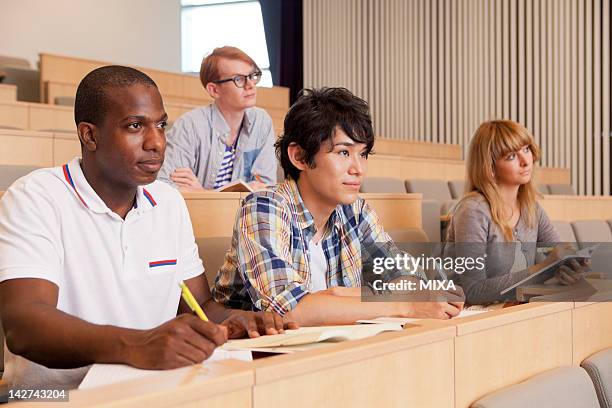 university students studying in lecture theater - international student day stock pictures, royalty-free photos & images