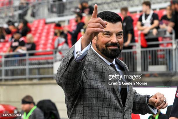 Ohio State Buckeyes head coach Ryan Day points to fans as he enters the stadium before playing the Wisconsin Badgers at Ohio Stadium on September 24,...