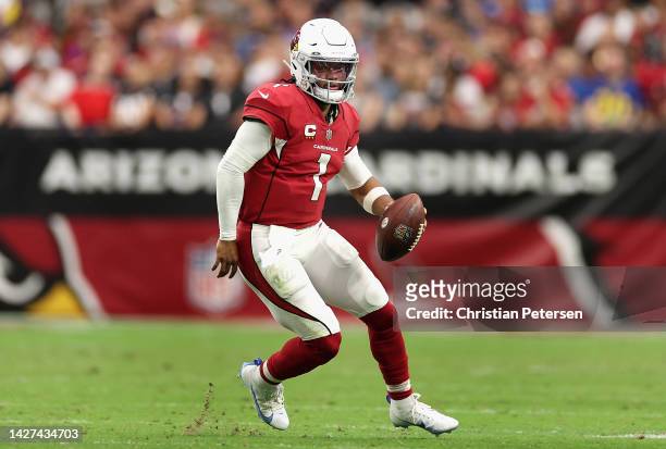 Quarterback Kyler Murray of the Arizona Cardinals scrambles with the football during the second half of the NFL game against the Los Angeles Rams at...