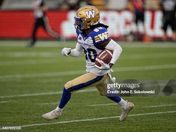 Janarion Grant of the Winnipeg Blue Bombers returns a kick against the Hamilton Tiger-Cats at Tim Hortons Field on September 17, 2022 in Hamilton,...