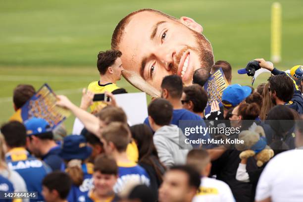 Clinton Gutherson signs autographs during a Parramatta Eels NRL training session at Kellyville Park on September 26, 2022 in Sydney, Australia.