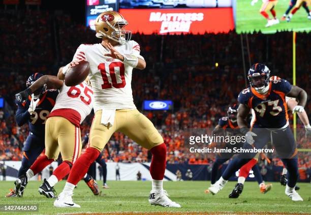Jimmy Garoppolo of the San Francisco 49ers looks to pass from his own end zone during the second half against the Denver Broncos at Empower Field At...