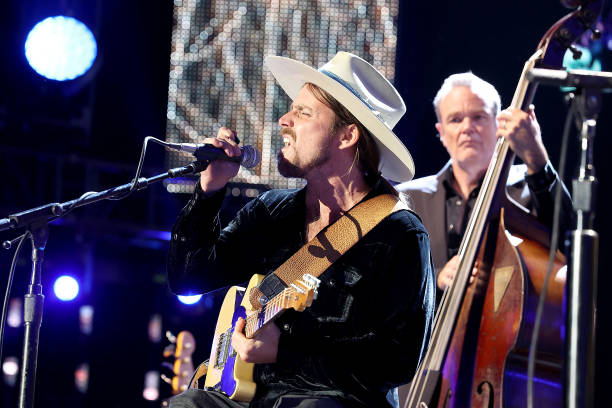 Lukas Nelson performs in concert with his father, Willie Nelson during Farm Aid at Coastal Credit Union Music Park at Walnut Creek on September 24,...