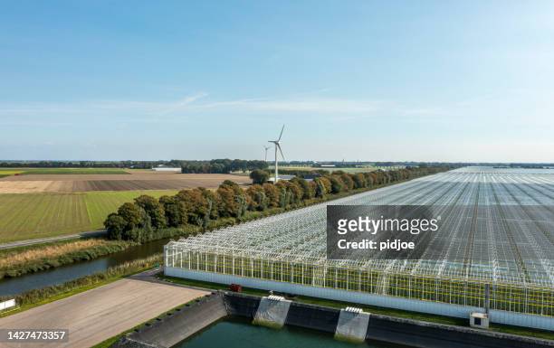 aerial view of a modern agricultural greenhouse in the netherlands - glass material stock pictures, royalty-free photos & images