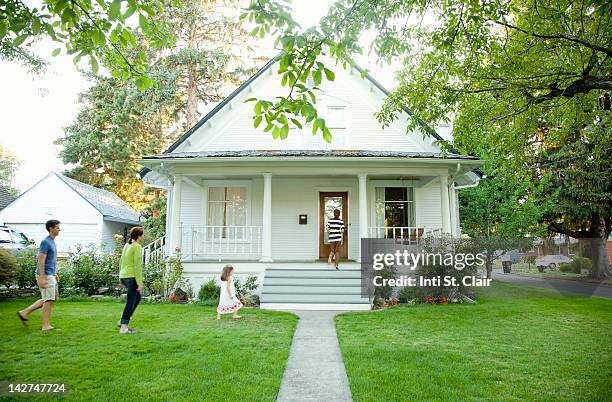 kids (4-5, 12-13) with parents walking into house - distant family stock pictures, royalty-free photos & images