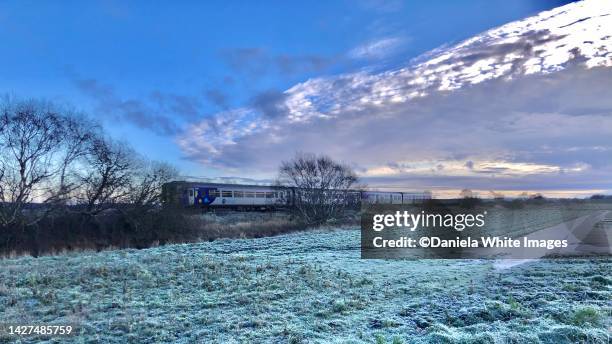 winter scene with train near scarisbrick, england - february stock pictures, royalty-free photos & images