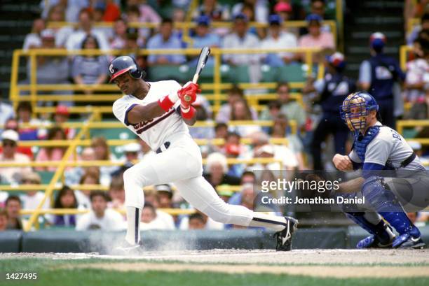 Sammy Sosa of the Chicago White Sox connects with the ball during their game against the Seattle Mariners at Comiskey Park in Chicago, Illinois on...