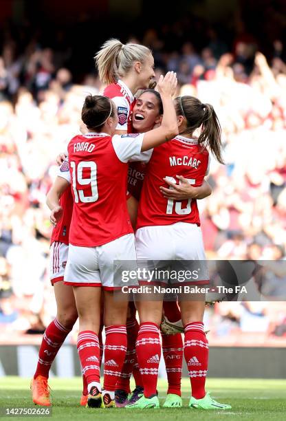 Rafaelle Souza of Arsenal celebrates scoring their team's third goal with teammates during the FA Women's Super League match between Arsenal and...