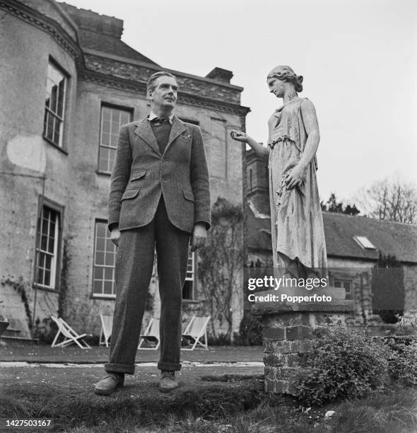 British Conservative Party politician Anthony Eden , Foreign Secretary in Churchill's wartime coalition government, stands in the garden of his...