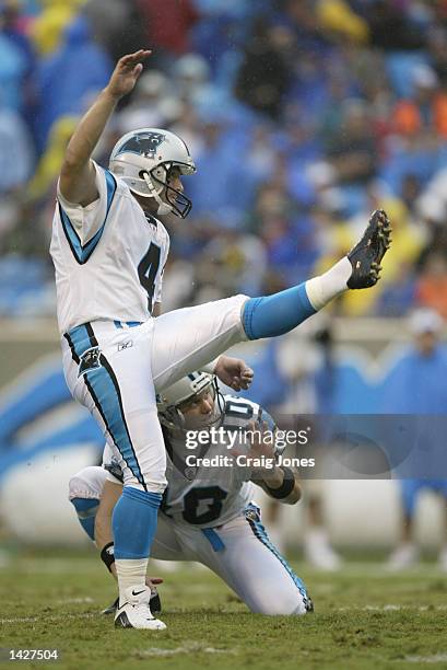 Placekicker John Kasay of the Carolina Panthers kicks out of a hold by punter Todd Sauerbrun during the NFL game against the Detroit Lions at...