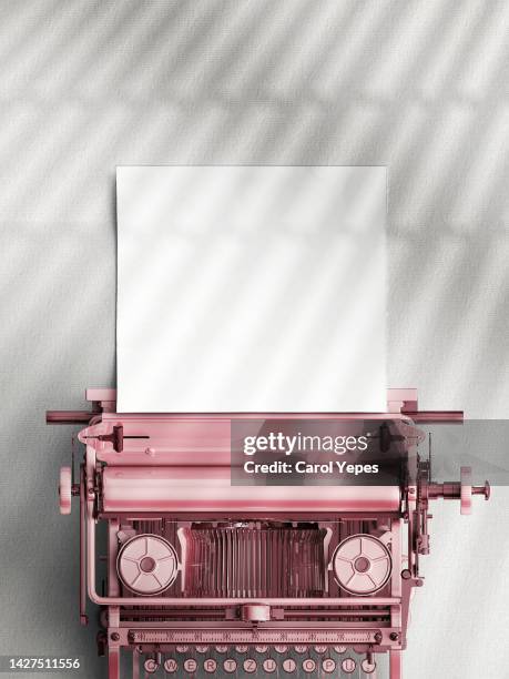 top view of a typewriter from the 70s with blank paper for text, isolated on grey background. - table font view stock pictures, royalty-free photos & images