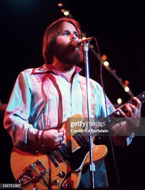 Carl Wilson performs with The Beach Boys at the Oakland Coliseum Arena on December 15, 1976 in Oakland, California.