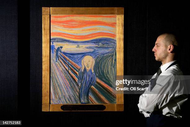 Gallery technician at Sotheby's auction house views 'The Scream' by Edvard Munch on April 12, 2012 in London, England. The iconic painting is on...