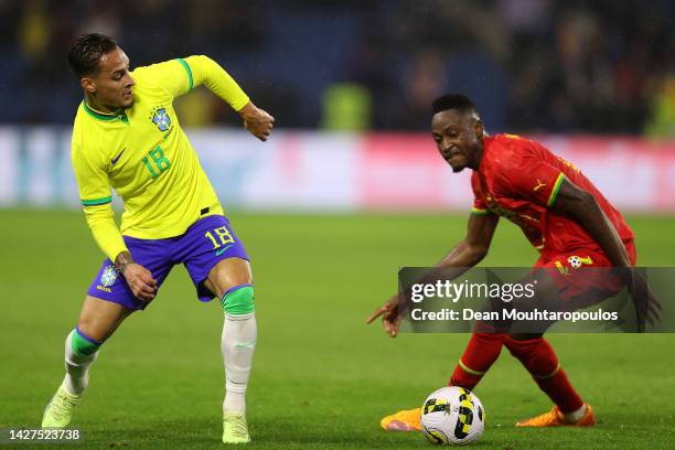 Baba Rahman of Ghana battles for the ball with Antony of Brazil during the international friendly match between Brazil and Ghana at Stade Oceane on...