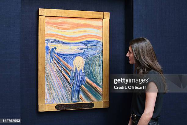 Woman in Sotheby's auction house views 'The Scream' by Edvard Munch on April 12, 2012 in London, England. The iconic painting is on public exhibition...