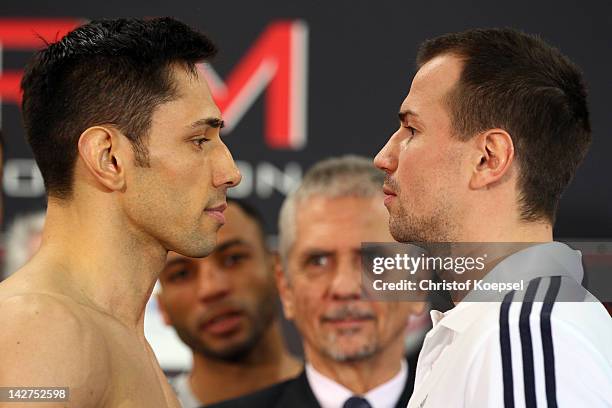 Felix Sturm of Germany and Sebastian Zbik of Germany look eye to eye after the weigh in at BMW Procar on April 12, 2012 in Cologne, Germany. The WBA...
