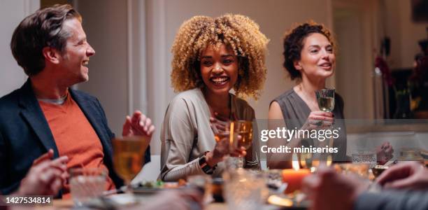 group of friends having fun during a dinner celebration - rubbing alcohol stock pictures, royalty-free photos & images