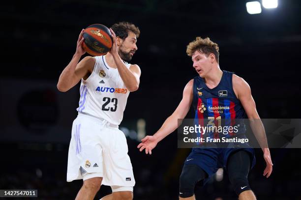 Sergio Llull of Real Madrid battles for the ball with Rokas Jokubaitis of FC Barcelona during the Supercopa Endesa final match between Real Madrid...