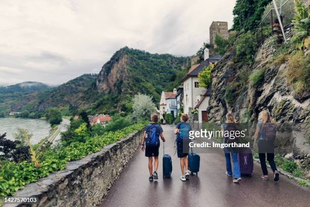 family sightseeing charming town of dürnstein - boys and girls town stock pictures, royalty-free photos & images