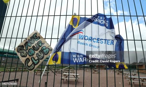 Flags and posters, showing fans support for the team, on the gates of the Sixways Stadium, home of Worcester Warriors, on September 26, 2022 in...